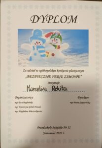 dyplom za udział w konkursie "Bezpieczne ferie zimowe" dla Marceliny Rekity