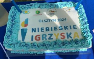 Tort z napisem Olsztyn 2024 Niebieskie Igrzyska